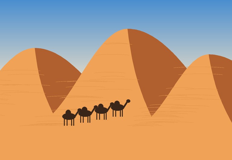 Camel caravan crossing orange dunes of Erg Chebbi